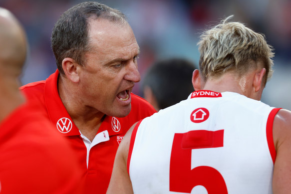 John Longmire has a word with Isaac Heeney.