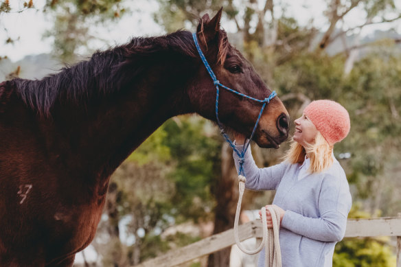 Equine therapist Jessica Liston, pictured with retired racehorse Jorge, says all horses should be trained for purposes other than racing.
