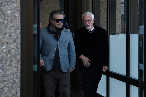 Titus Day’s father (right) leaves the Court of Criminal Appeal on Friday.
