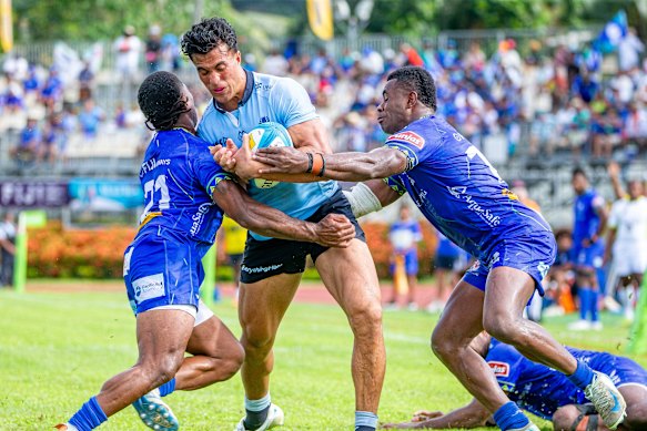 Joseph-Aukuso Suaalii taking on the Drua last year in Super Rugby.