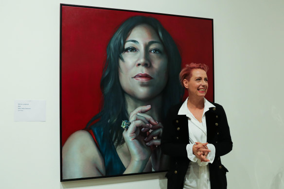 Artist Kathrin Longhurst with her Packing Room Prize-winning portrait of Kate Ceberano. 