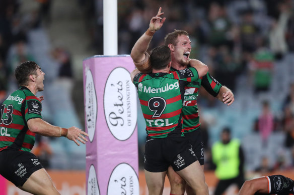 Rabbitohs front-rower Tom Burgess celebrates scoring the winning try against the Wests Tigers.