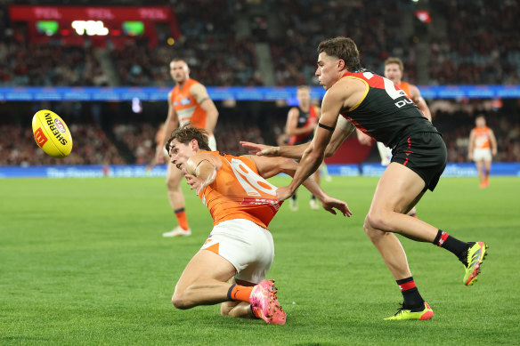 Conor Stone of the Giants is challenged by Sam Durham of the Bombers.