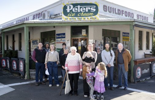Ray Pattle (far right), Liz Monty next to him, Penny Zepnick, holding baby, and other locals want to reopen the Guildford general store.