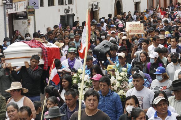 People attend the funeral procession of Clemer Rojas, 23, who was killed during protests against new President Dina Boluarte, in Ayacucho, Peru on Saturday, December 17.