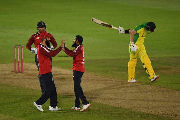 Adil Rashid (right) celebrates the wicket of Steve Smith, one of three scalps taken by the English spinner.