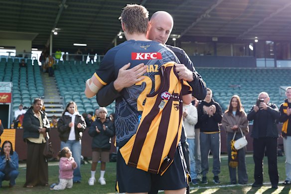 David Hale presents Noah Mraz with his jumper before his debut 