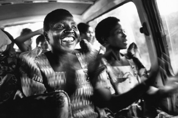 HIV-positive woman Florence Kumunhyu sings about AIDS as part of an educational program in Uganda in 2001. 