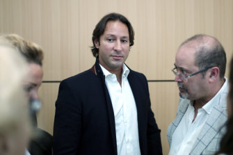 Saudi princess Hassa bint Salman's bodyguard Raina Said, centre, leaves the courthouse in Paris.