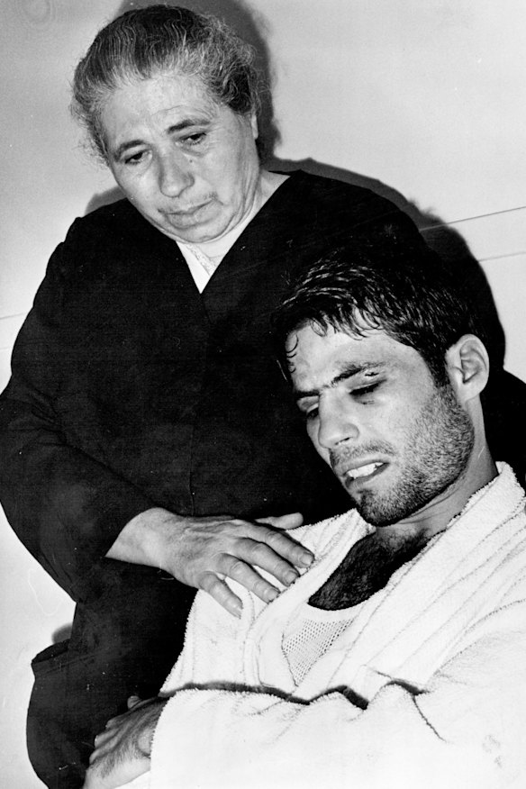 Mrs. Gattellari consoles her son after the fight.