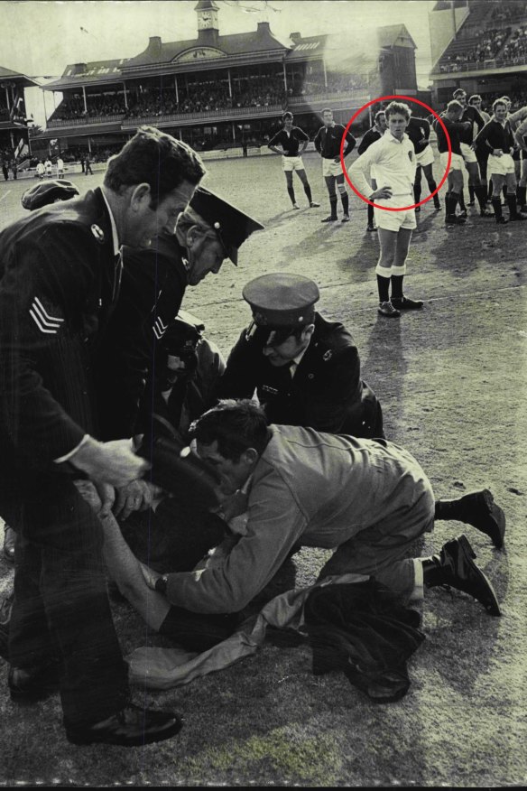 ABC broadcaster Jim Maxwell (circled) as a 21-year-old ballboy during the Springboks-NSW game at the SCG in 1971