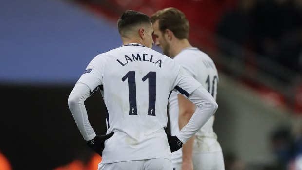 Tottenham's Erik Lamela and Harry Kane leave the field at Wembley.