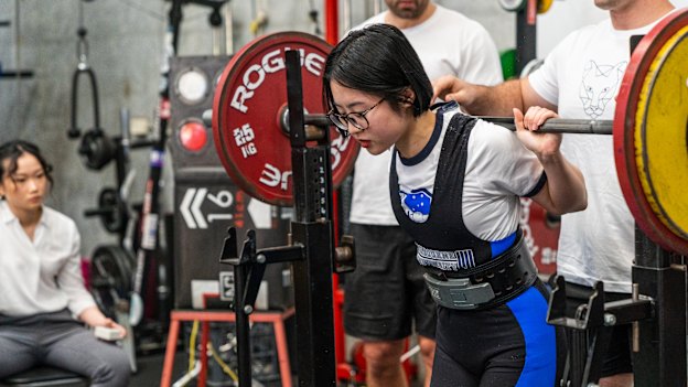 Dori Qu, 22, competing in a recent powerlifting competition.