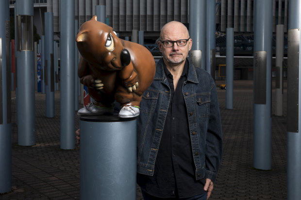 Cartoonist Paul Newell with the new sculpture of Fatso that will soon be restored to its plinth outside ANZ Stadium.