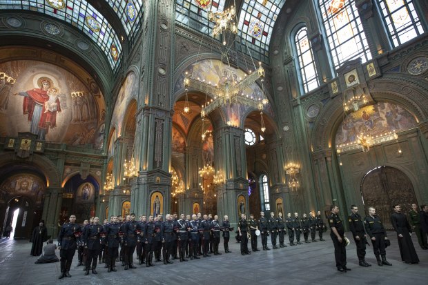 Russian servicemen attend a service at the cathedral. 