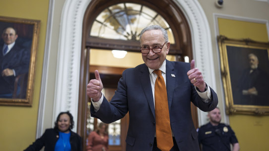 Senate Majority Leader Chuck Schumer celebrates as the Senate begins voting on the government funding bill just in time to meet the midnight deadline.