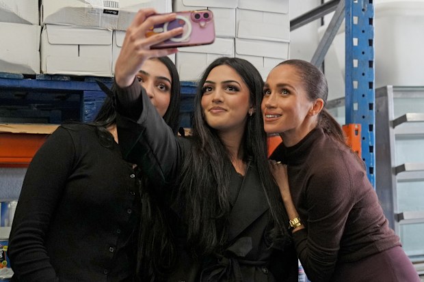 Meghan, Duchess of Sussex, right, visits the Himmah Hub in Nottingham, England