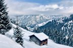 A snow-covered hutte in Switzerland’s Graubunden region.