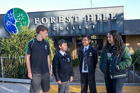 Students Zac Rosso, Albert Teluk,  Ty Hwee and Emily Youssef. Albert and Ty are wearing the school’s new uniform.
