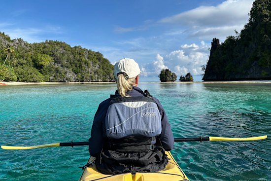 Kayakers set out from the liveaboard yacht, Jakaré.