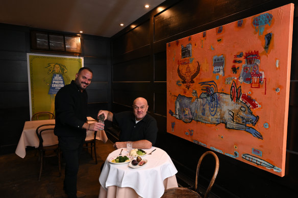 Stavros Konis (left) and Con Christopoulos in the small dining room.