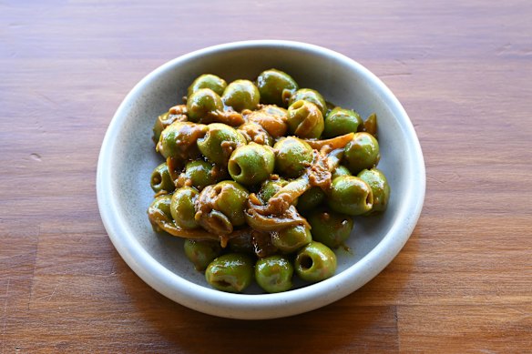 Olives pickled with turmeric, garlic and chilli.