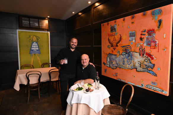 Artwork and design flourishes move the restaurant away from Greek stereotypes.