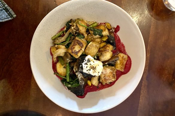 Gnocchi with beetroot puree, goat cheese, pistachios and field mushrooms.