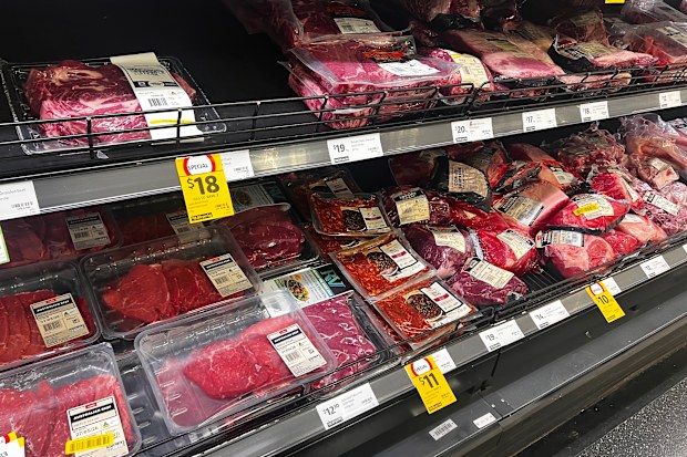 Packets of beef and meat in a supermarket.