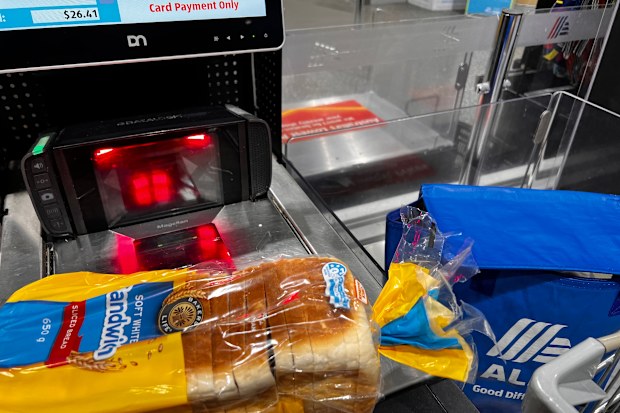 Aldi self checkout showing a packet of sliced bread that is about to be scanned