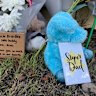 Tributes at the scene in Regents Park where a father and his four-year-old son were hit and killed by a ute.