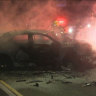 Manhunt under way after fiery crash leaves man critical