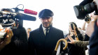 Soccer legend David Beckham is surrounded by media after paying his respects to the Queen. 