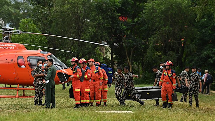Boots on the ground as first Australian rescue team arrives in Nepal