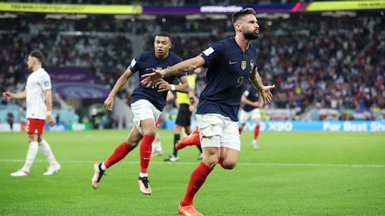 Olivier Giroud celebrates scoring for France against Poland.