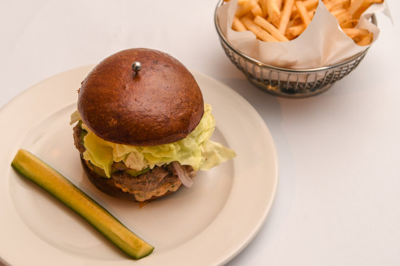 A very restaurant-y cheeseburger, served with thin, crisp fries.