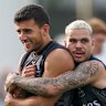Bobby Hill embraces Nick Daicos at training this week.