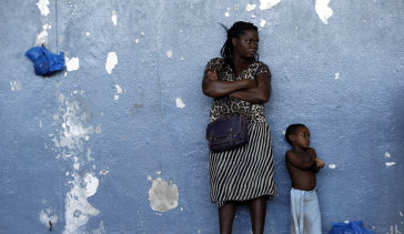 A woman and her child outside a displacement centre in Beira, Mozambique,