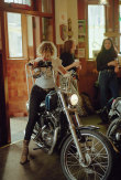 From Em Jensen’s ‘Sheilas’ series, titled: ‘Sarah pulling into the Retreat Hotel to meet the Leatherettes for a drink’.