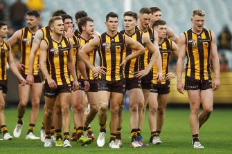 Jaeger O’Meara and his Hawthorn teammates leave the field dejected. 