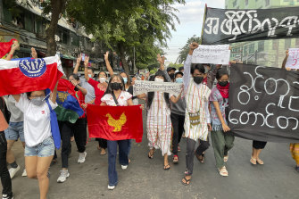 Pro-democracy protesters hold a flash mob rally to protest against Myanmar’s military-installed government, at Kyauktada township in Yangon, on December 20.