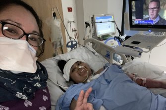Saela in hospital with her mother, Michelle, as she recovers from COVID-19.