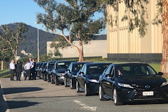 No more big white limos for Canberra's pollies. The new Commonwealth fleet is black, imported and hybrid. 