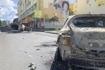 Charred cars in Le Gosier, Guadeloupe. French authorities sent police special forces to the Caribbean island as protests over COVID-19 restrictions erupted into rioting and looting for a third day.