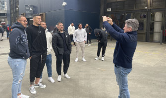 Nine CEO Mike Sneesby takes photos of fans with Sonny Bill Williams.
