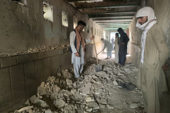 Terrorist attacks are still rife in Afghanistan. Here, people inspect the inside of a mosque following a suicide bomber’s attack in the city of Kandahar last month.