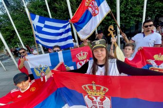 Supporters of Serbian tennis star Novak Djokovic outside the Federal Court in Melbourne on Sunday. Mina Zogovic is in the middle right.