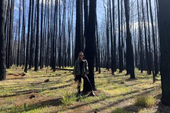 Eva Orner among bushfire-blackened trees.