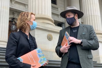 Minister for Aboriginal Affairs Gabrielle Williams receives the First Peoples’ Assembly annual report from Assembly Co-Chair Marcus Stewart on Thursday.
