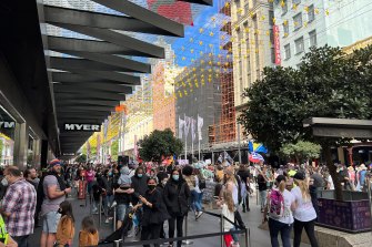 As many young families lined up for a peek at this year’s Myer Christmas windows, protesters provided a sometime unwelcome spectacle as they flowed down Bourke Street Mall.